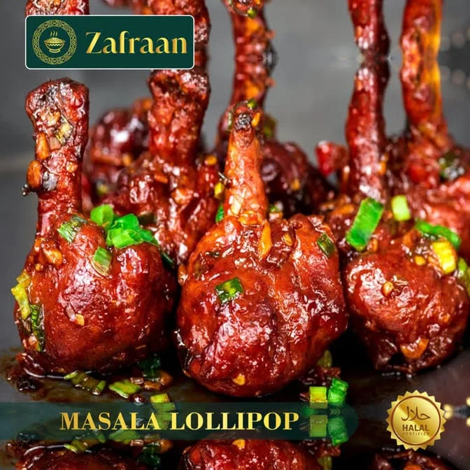 Masala Lollipop coated in a glossy, richly spiced sauce